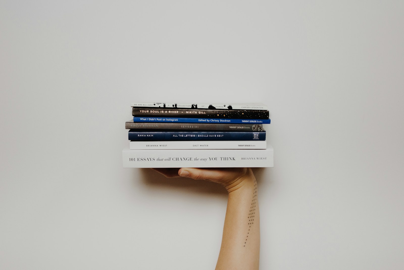 Books arranged on a wooden shelf