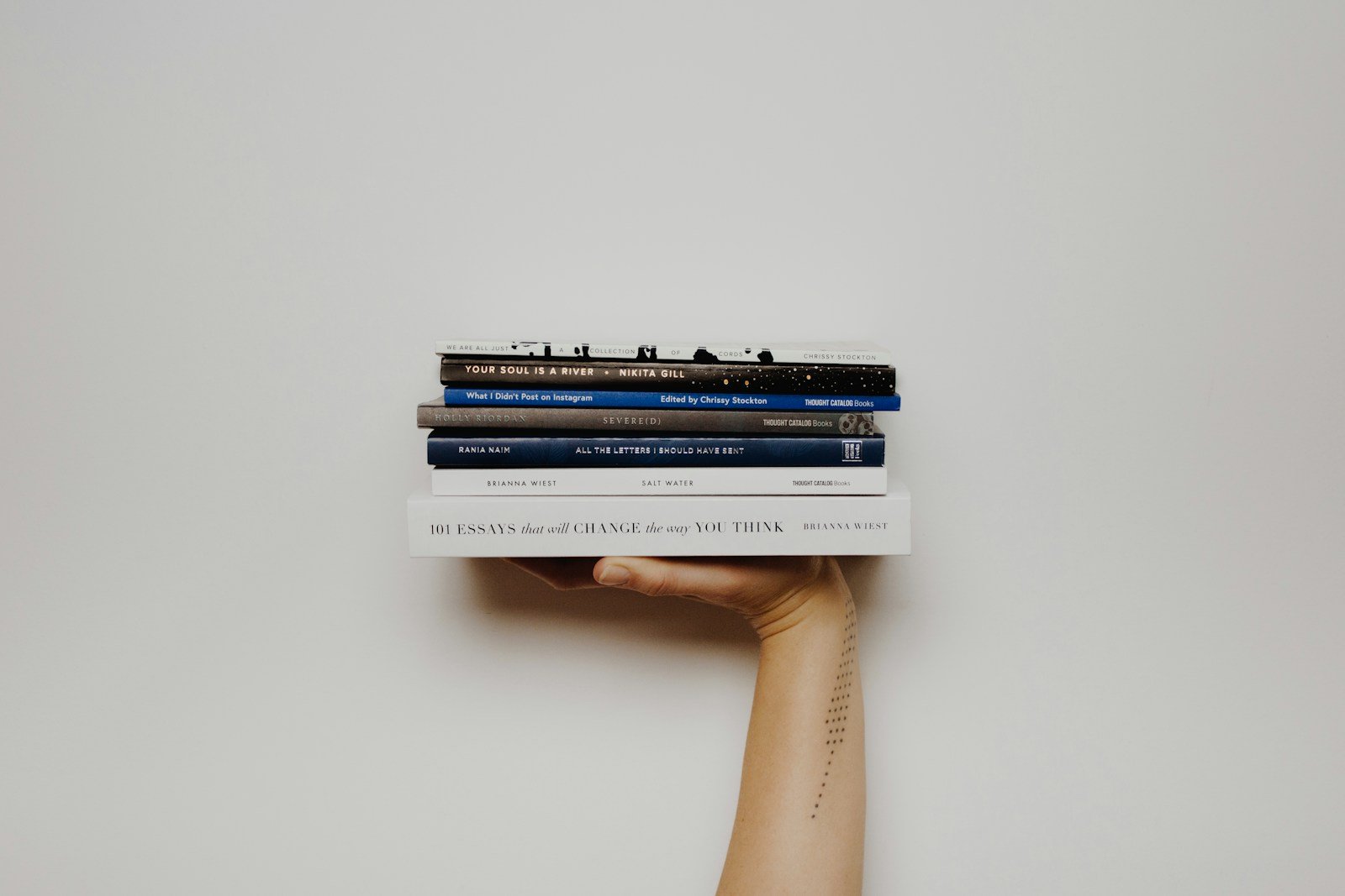 Books arranged on a wooden shelf